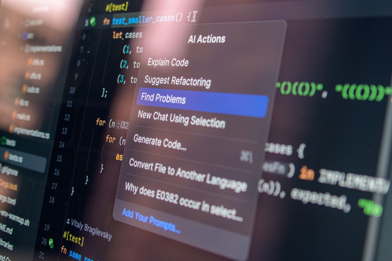 services-03 Close-up of AI-assisted coding with menu options for debugging and problem-solving.